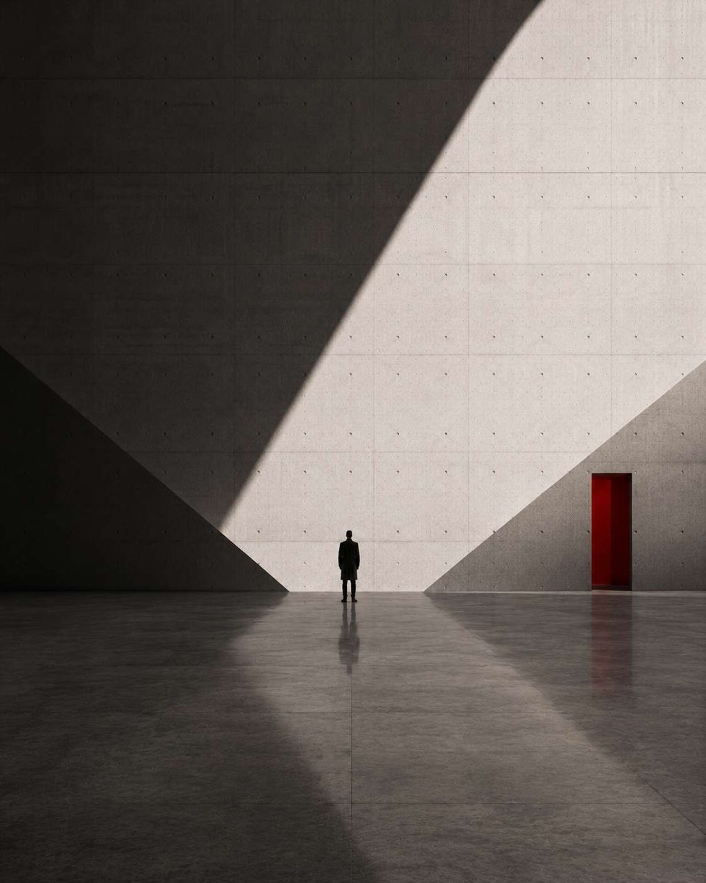 A lone figure in a vast concrete hall, divided by a single hard diagonal of daylight, a red doorway beyond.