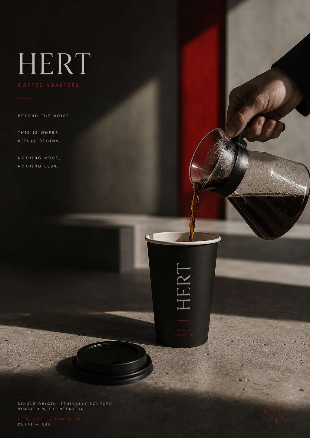 Filter coffee being poured into a branded takeaway cup in a shaft of raking daylight.